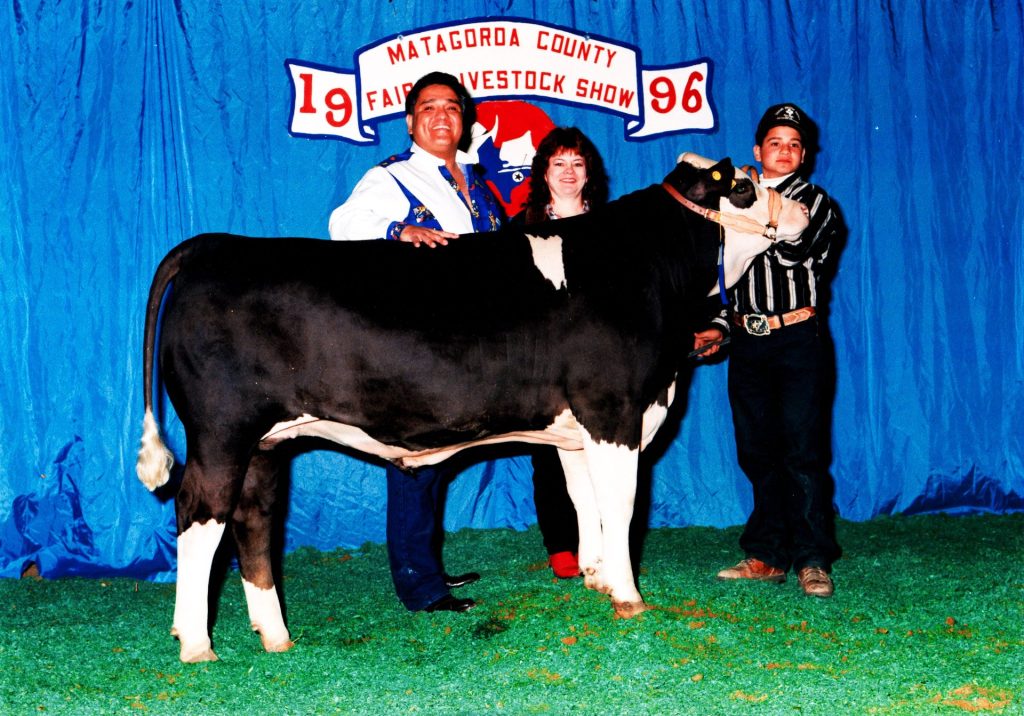 Youth livestock exhibitor with a steer at the Matagorda County Fair & Livestock Show, 1996