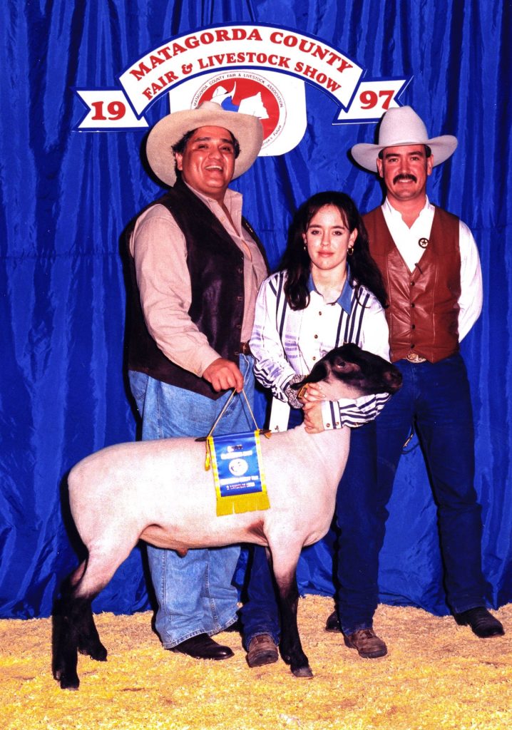 Youth livestock exhibitor with a lamb at the Matagorda County Fair & Livestock Show, 1997