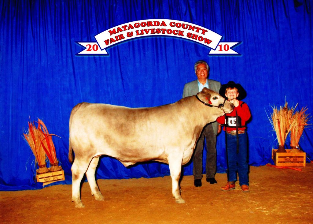 Youth livestock exhibitor with a steer at the Matagorda County Fair & Livestock Show, 2010