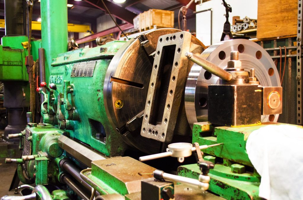 Orifice fitting being machined on a large lathe