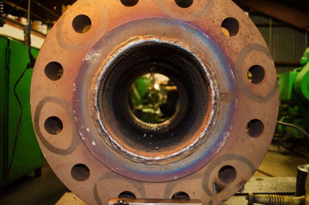 Flange face with weld overlay