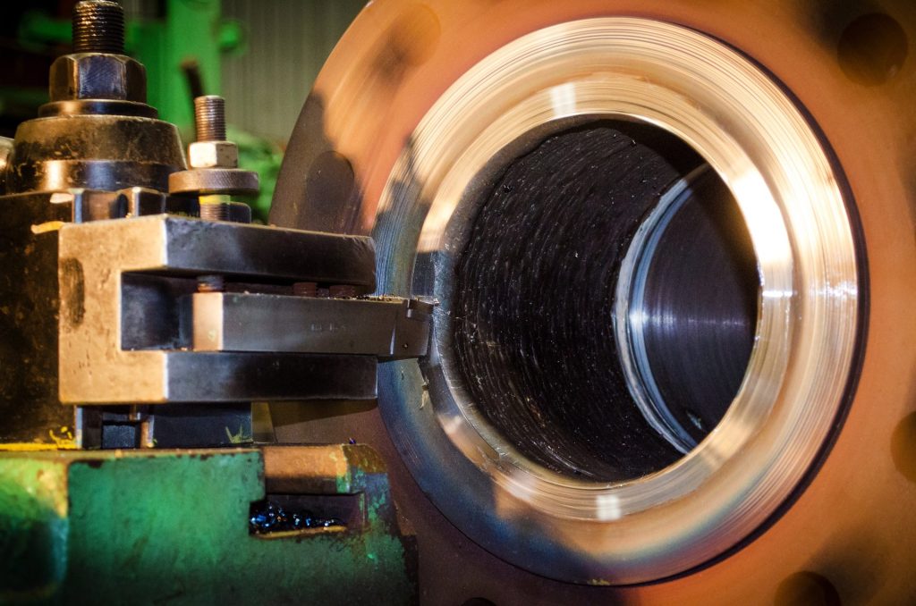 Machining the bore of an orifice fitting