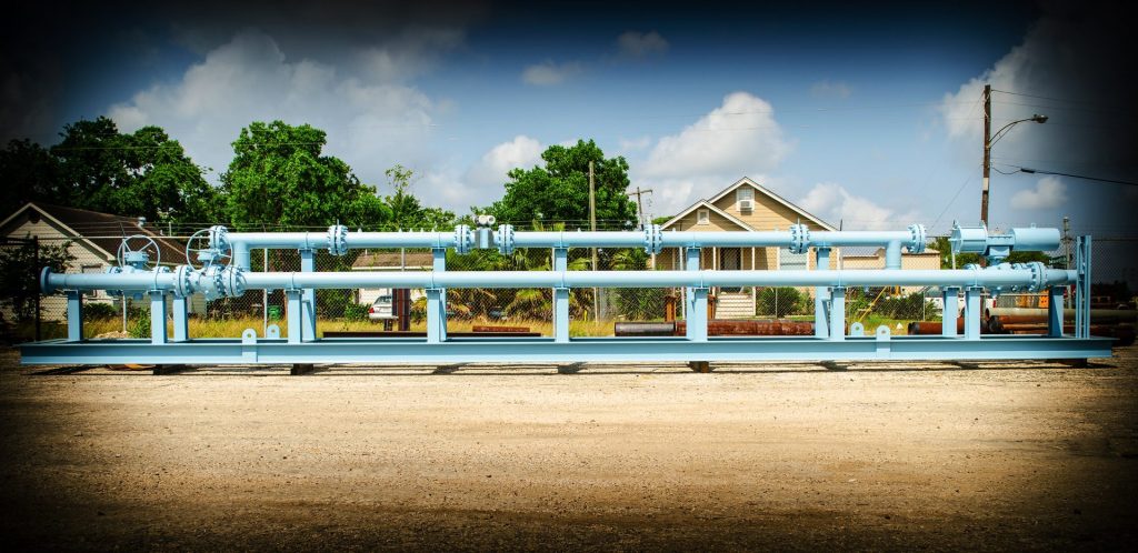 Blue meter run skid fabricated by FAB Industries in the Houston yard